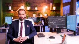 Front view with a businessman in a modern office. Blue lightan and moon light